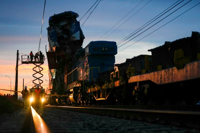 A train sits on top of another after colliding in San Bernardo, Santiago, Chile, Thursday, June 20, 2024. (AP Photo/Esteban Felix)