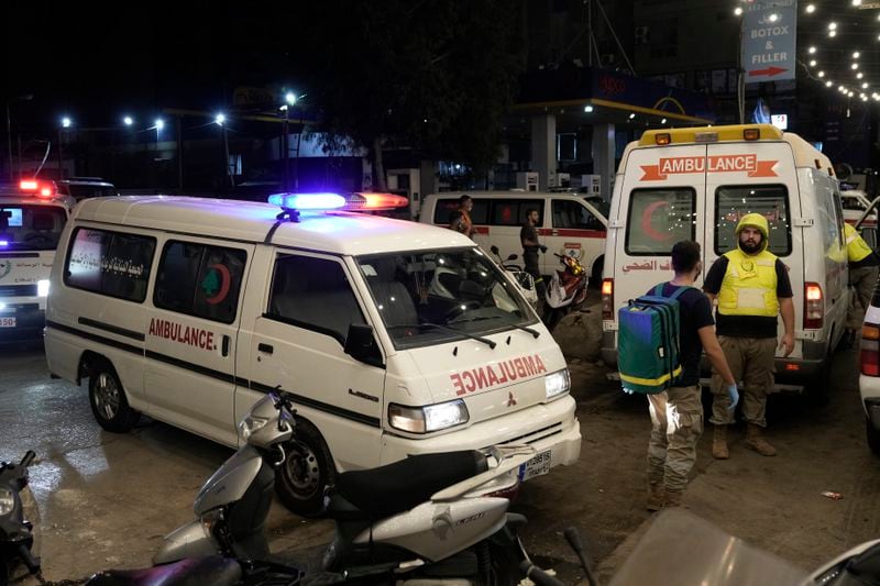 Ambulances arrive to evacuate the wounded near the site of an Israeli airstrike in Beirut's southern suburb, Monday, Sept. 23, 2024. (AP Photo/Bilal Hussein)