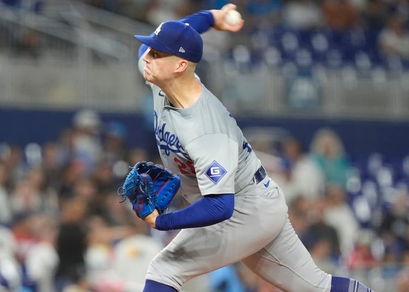 Los Angeles Dodgers pitcher Bobby Miller aims a pitch during the first inning of a baseball game against the Miami Marlins, Tuesday, Sept. 17, 2024, in Miami. (AP Photo/Marta Lavandier)