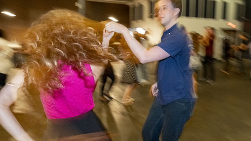 Wilder Smith shows off moves with co-instructor Josie Brown while teaching a weekly dance class at Wild Heaven West End. Ben Gray/ben@bengray.com