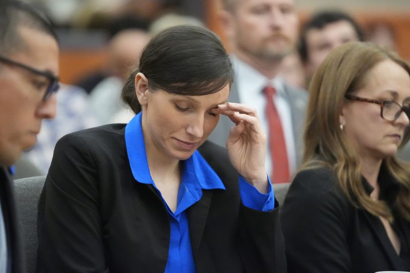 Kouri Richins, a Utah mother of three who wrote a children's book about coping with grief after her husband's death and was later accused of fatally poisoning him, looks on during a hearing Tuesday, Aug. 27, 2024, in Park City, Utah. (AP Photo/Rick Bowmer, Pool)