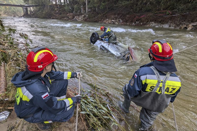 This handout photo provided by the State Fire Service of Poland, shows firefighters work at a cite of a flooding, near Stronie Slaskie, southwestern Poland, Thursday, Sept. 19, 2024. (Tomasz Fijolek/KG PSP via AP)