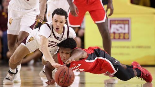 Jaelen House (left) of the Arizona State Sun Devils and Sahvir Wheeler of the Georgia Bulldogs dive for a loose ball.  (Photo by Christian Petersen/Getty Images)