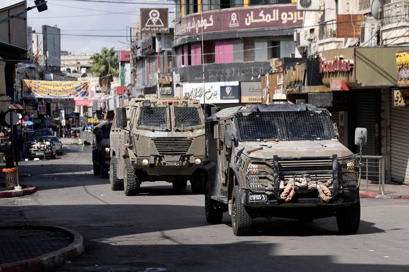 Israeli army jeeps move into the West Bank city of Nablus during a raid, Sunday, Sept. 22, 2024,(AP Photo/Majdi Mohammed).