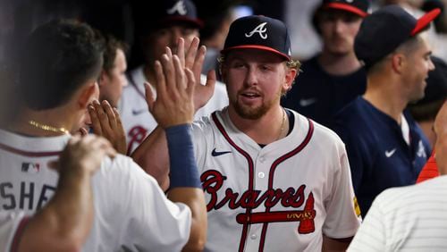 Atlanta Braves pitcher Spencer Schwellenbach greets teammates after pitching into the seventh inning against the New York Mets at Truist Park, Tuesday, Sept. 24, 2024, in Atlanta. The Braves won 5-1. (Jason Getz / AJC)

