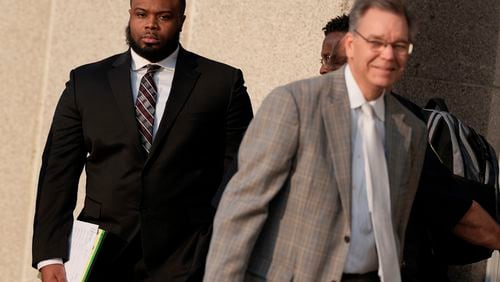 Former Memphis police officer Demetrius Haley, left, leaves the federal courthouse after the first day of jury selection of the trial in the Tyre Nichols case Monday, Sept. 9, 2024, in Memphis, Tenn. (AP Photo/George Walker IV)