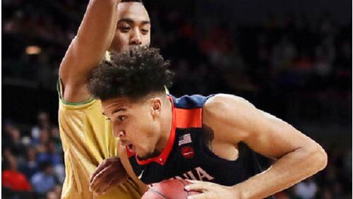 Virginia forward Isaiah Wilkins (21) drives against Notre Dame forward Bonzie Colson during the first half of an NCAA college basketball game during the quarterfinals of the Atlantic Coast Conference tournament, Thursday, March 9, 2017, in New York. (AP Photo/Julie Jacobson)