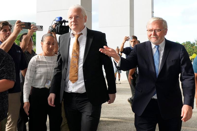WikiLeaks founder Julian Assange, centre arrives at the United States courthouse where he is expected enter a plea deal, in Saipan, Mariana Islands, Wednesday, June 26 2024. (AP Photo/Eugene Hoshiko)