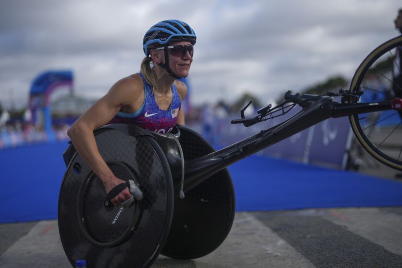 Susannah Scaroni of the U.S. reacts after winning the bronze medal in the women's marathon T54 at the 2024 Paralympics, Sunday, Sept. 8, 2024, in Paris, France. (AP Photo/Thibault Camus)