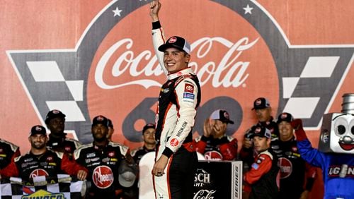 Driver Christopher Bell celebrates in Victory Lane after winning a NASCAR Cup Series auto race at Charlotte Motor Speedway, Sunday, May 26, 2024, in Concord, N.C. (AP Photo/Matt Kelley)