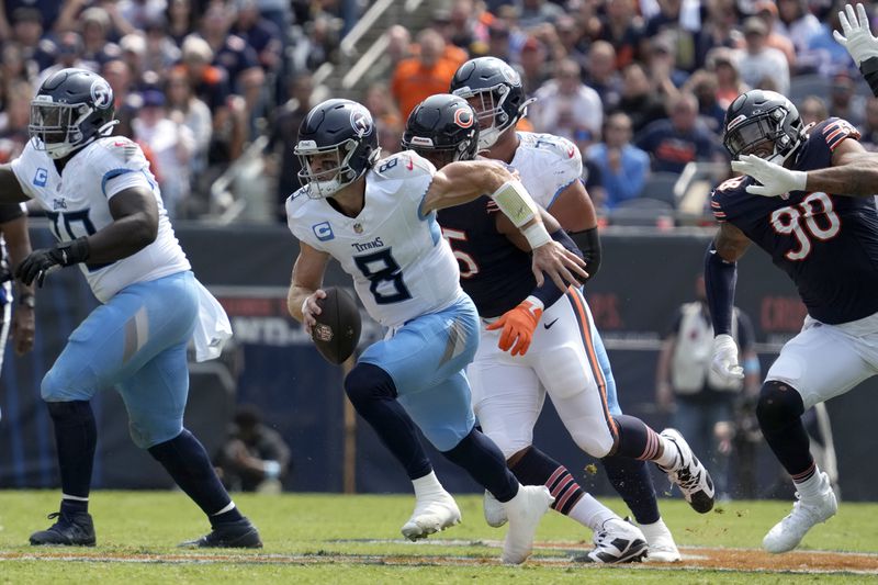 Tennessee Titans quarterback Will Levis scrambles during the first half of an NFL football game against the Chicago Bears on Sunday, Sept. 8, 2024, in Chicago. (AP Photo/Nam Y. Huh)