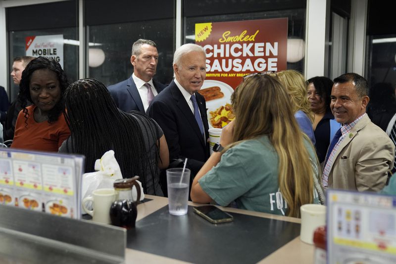 President Joe Biden greets supporters at a Waffle House in Marietta, Ga., Friday, June 28, 2024, following a presidential debate in Atlanta. (AP Photo/Evan Vucci)