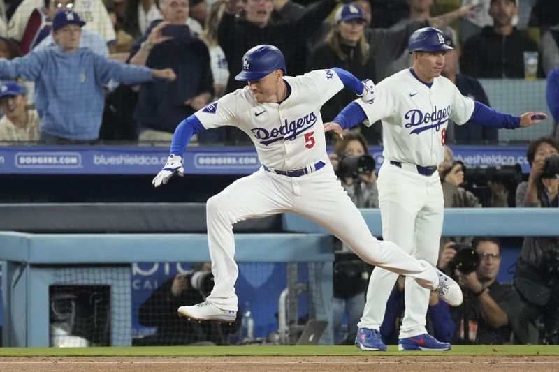 Los Angeles Dodgers' Freddie Freeman (5) suffers an injury after grounding out during the seventh inning of a baseball game against the San Diego Padres, Thursday, Sept. 26, 2024, in Los Angeles. (AP Photo/Mark J. Terrill)