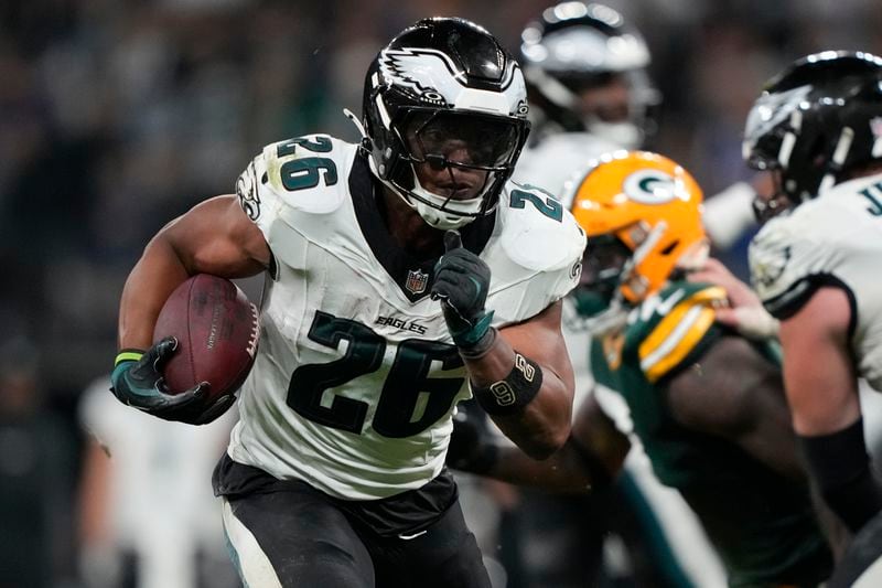 Philadelphia Eagles running back Saquon Barkley (26) runs for a touchdown against the Green Bay Packers during the first half of an NFL football game, Friday, Sept. 6, 2024, at the Neo Quimica Arena in Sao Paulo. (AP Photo/Doug Benc)