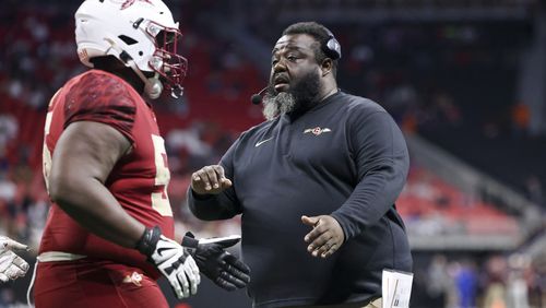 Creekside head coach Maurice Dixon greets a lineman after a Creekside touchdown during the second half against Coffee in the 2023 Class 5A GHSA State Championship game at Mercedes-Benz Stadium, Wednesday, December. 13, 2023, in Atlanta. Creekside will be favored to win its region in 2024.