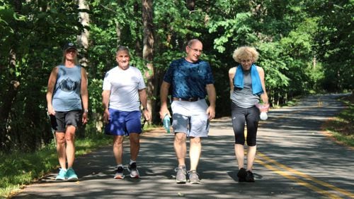 (L to R) LuAnn DelVerme, Lou DelVerme, Brad McCahill and Waunelle Jackson-Ian walk nearly every day at Kennesaw Mountain and said they support closing the road to cars and limiting bike access due to safety concerns on Monday, July 1, 2024. (Taylor Croft/taylor.croft@ajc.com)