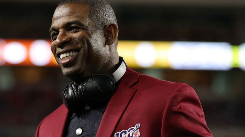 Defensive back Deion Sanders of the Atlanta Falcons looks on prior