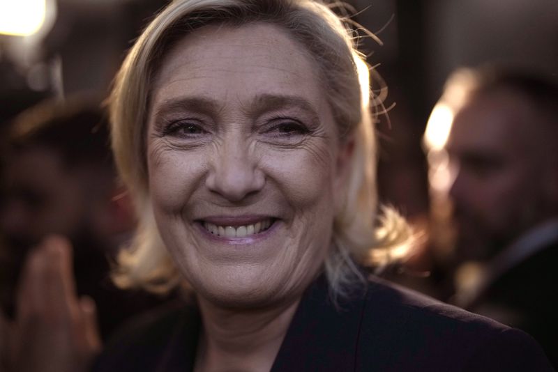 French far right leader Marine Le Pen smiles after delivering her speech after the release of projections based on the actual vote count in select constituencies , Sunday, June 30, 2024 in Henin-Beaumont, northern France. French voters propelled the far-right National Rally to a strong lead in first-round legislative elections Sunday and plunged the country into political uncertainty, according to polling projections. (AP Photo/Thibault Camus)
