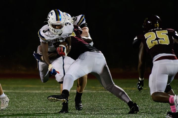 Chamblee's Larry Harris gets tackled during their game against Tucker, October 6, 2023. (Jamie Spaar for the Atlanta Journal Constitution)