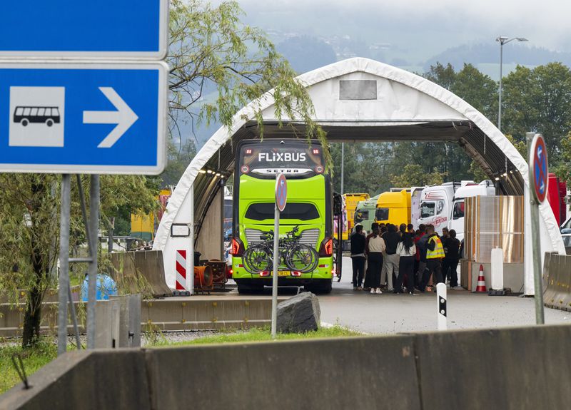 A coach coming from Austria is checked at the border checkpoint on the A93 highway near Kiefersfelden on the German side Monday, Sept. 16, 2024. (Peter Kneffel/dpa via AP)