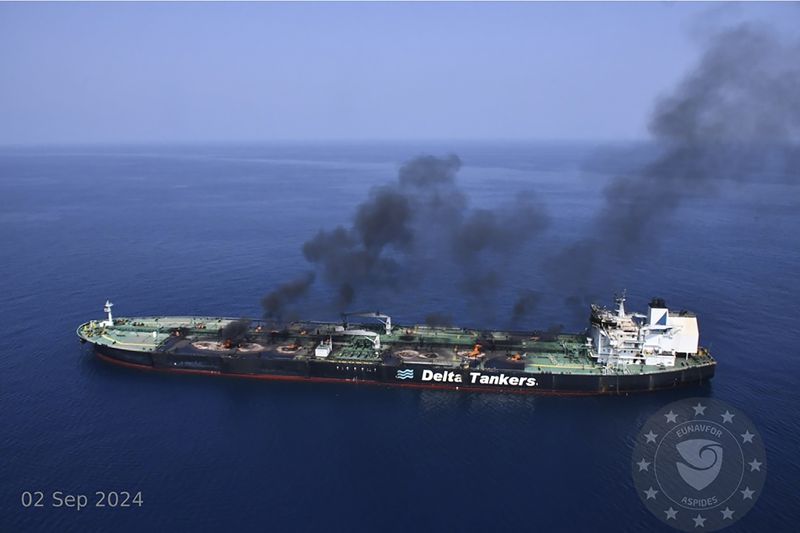 This photo released by the European Union's Operation Aspides naval force shows the Greek-flagged oil tanker Sounion burning in the Red Sea following a series of attacks by Yemen's Houthi rebels on Monday, Sept. 2, 2024. (European Union's Operation Aspides via AP)