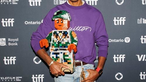 Pharrell Williams arrives on the red carpet for the premiere of 'Piece by Piece' at the Princess of Wales Theatre during the Toronto International Film Festival in Toronto, Tuesday, Sept. 10, 2024. (Cole Burston/The Canadian Press via AP)