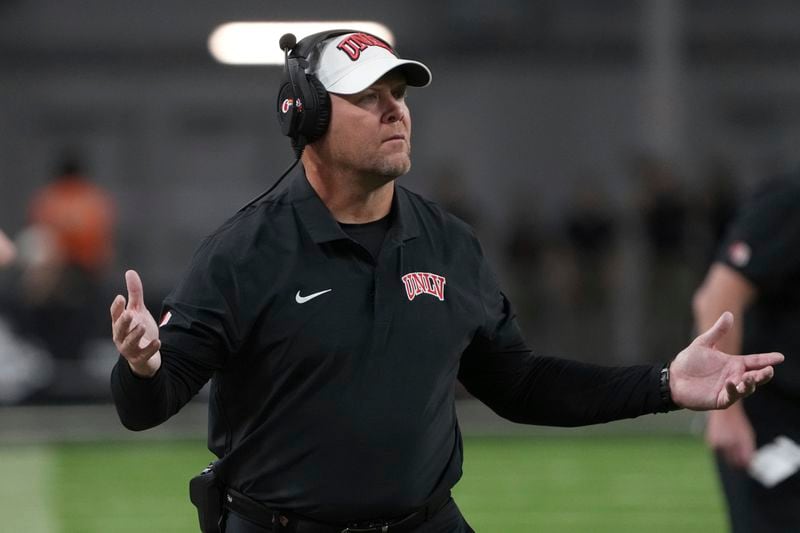 UNLV head coach Barry Odom reacts to a holding foul in the first half during an NCAA college football game against Syracuse, Friday, Oct. 4, 2024, in Las Vegas. (AP Photo/Rick Scuteri)