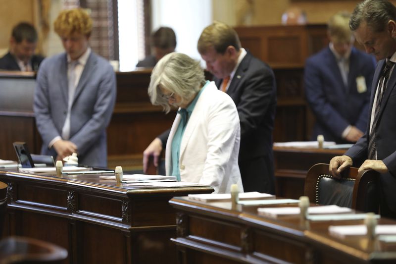Sen. Katrina Shealy, R-Lexington, prays before the start of the Senate session on Wednesday, June 26, 2024, in Columbia, S.C. Shealy and the other two Republican women Sister Senators were all voted out in their party's primary. (AP Photo/Jeffrey Collins)
