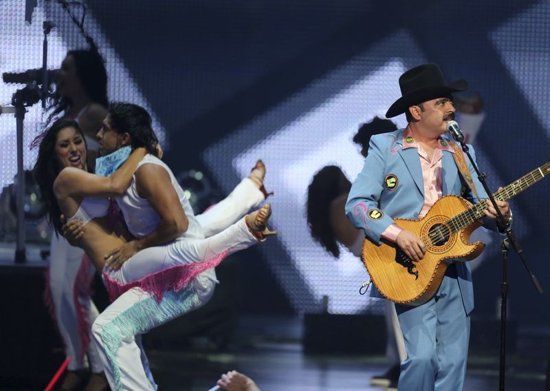 FILE - Los Tucanes de Tijuana, perform at the 2012 Billboard Mexican Music Awards at the Shrine Auditorium, in Los Angeles, Oct. 18, 2012. (Photo by J. Emilio Flores/Invision/AP File)