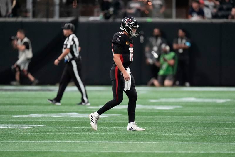 Atlanta Falcons quarterback Kirk Cousins walks off the field after an interception during the second half of an NFL football game against the Pittsburgh Steelers on Sunday, Sept. 8, 2024, in Atlanta. (AP Photo/John Bazemore)