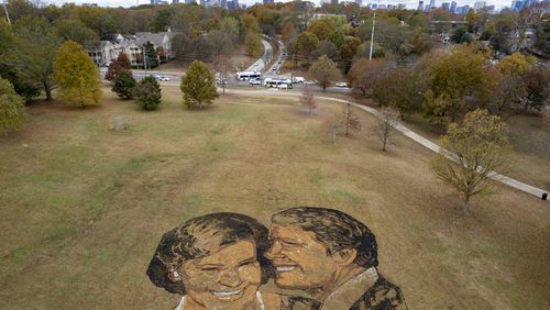 A portrait of Rosalynn and Jimmy Carter made from mulch, peat moss and stones sits on a hill in Freedom Park in Atlanta on Wednesday, Nov. 22, 2023.   (Ben Gray / Ben@BenGray.com)