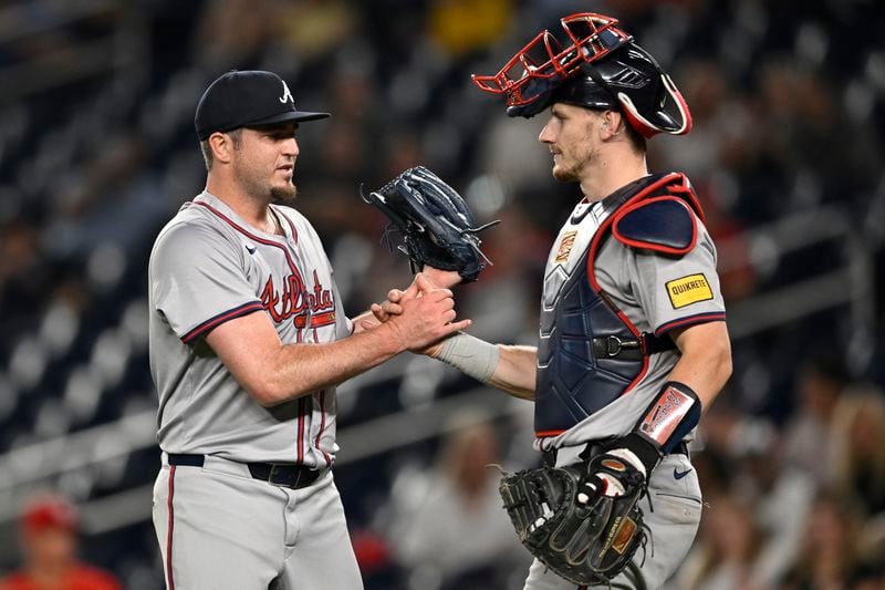 Atlanta Braves relief pitcher Luke Jackson, left, is congratulated by Braves catcher Sean Murphy after finishing off the ninth inning to defeat the Washington Nationals in a baseball game, Tuesday, Sept. 10, 2024, in Washington. (AP Photo/John McDonnell)