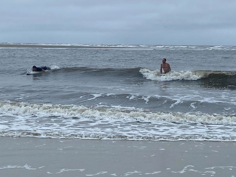 Despite red warning lights indicating high hazard at East Beach and Gould’s Inlet on St. Simons Island on Georgia's coast, a few surfers and boogie boarders took to choppy waters on Tuesday, Aug. 6, 2024.