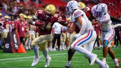 Brayden Tyson, running back for Brookwood HS, runs the ball to the goal line during the Corky Kell Classic at Mercedes Benz Stadium in Atlanta, GA on August 17, 2024. (Jamie Spaar for the Atlanta Journal Constitution)