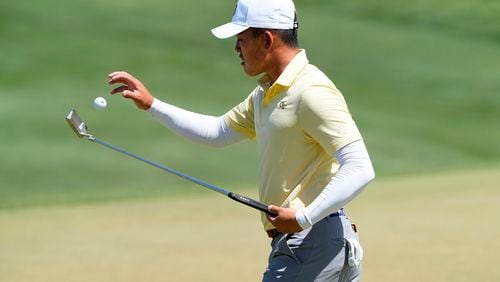 Georgia Tech golfer Hiroshi Tai flips up his ball from the second green during the final round of the NCAA college men's match play golf championship, Wednesday, May 31, 2023, in Scottsdale, Ariz. (AP Photo/Matt York)