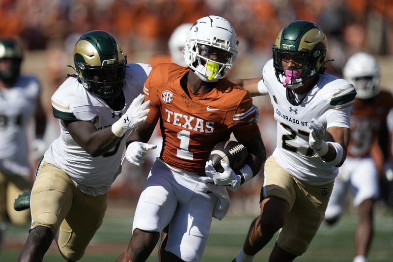 Texas wide receiver Johntay Cook II (1) runs up field against Colorado State after making a catch during the second half of an NCAA college football game in Austin, Texas, Saturday, Aug. 31, 2024. (AP Photo/Eric Gay)