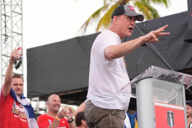 Florida Panthers head coach Paul Maurice, right, gestures during an NHL hockey rally and parade to celebrate the team's winning of the Stanley Cup by defeating the Edmonton Oilers, Sunday, June 30, 2024, in Fort Lauderdale, Fla. (AP Photo/Marta Lavandier)