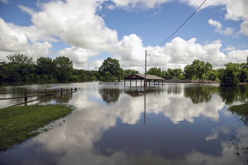 Rotary Park is underwater after days of heavy rain led to flooding in the area, Saturday, June 22, 2024 in Canton, S.D.(AP Photo/Josh Jurgens)