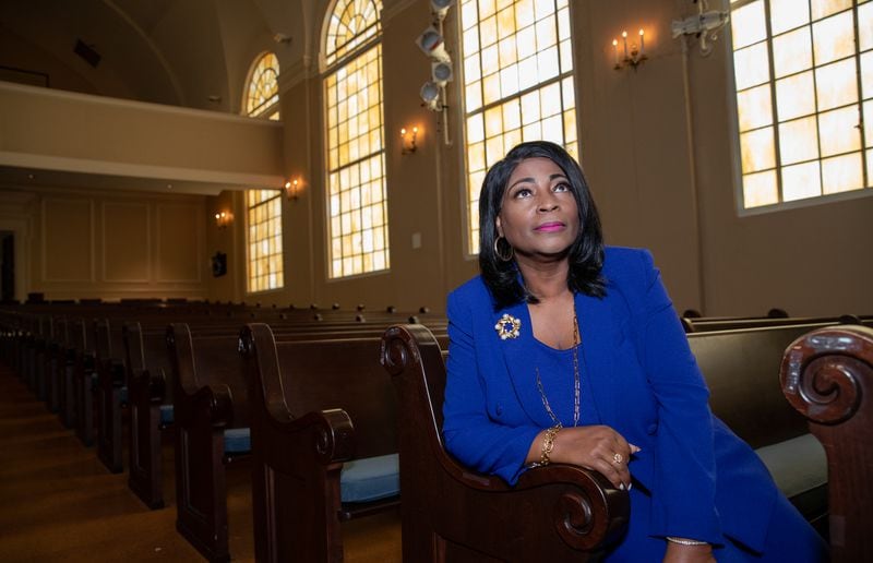 Dr. Angela Farris sits in Spelman College's Sisters Chapel, where she attended her grandmother's memorial service as a 10-year-old. "We are the manifestation of the casualties of a civil rights war," she says today. (Jenni Girtman for The Atlanta Journal-Constitution)