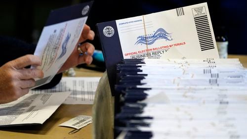 FILE - Chester County, Pa., election workers process mail-in and absentee ballots, in West Chester, Pa., Nov. 4, 2020. (AP Photo/Matt Slocum, File)