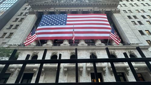 American flag hang from the front of the New York Stock Exchange on Tuesday, Sept. 10, 2024, in New York. (AP Photo/Peter Morgan)