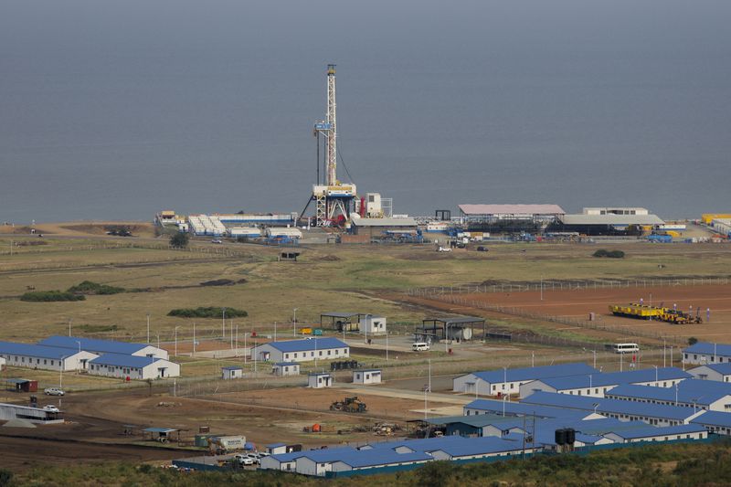 FILE - The drilling rig of the Kingfisher oil field, operated by China National Offshore Oil Corporation (CNOOC), is seen on the shores of Lake Albert in the Kikuube district of western Uganda Tuesday, Jan. 24, 2023. (AP Photo/Hajarah Nalwadda, File)