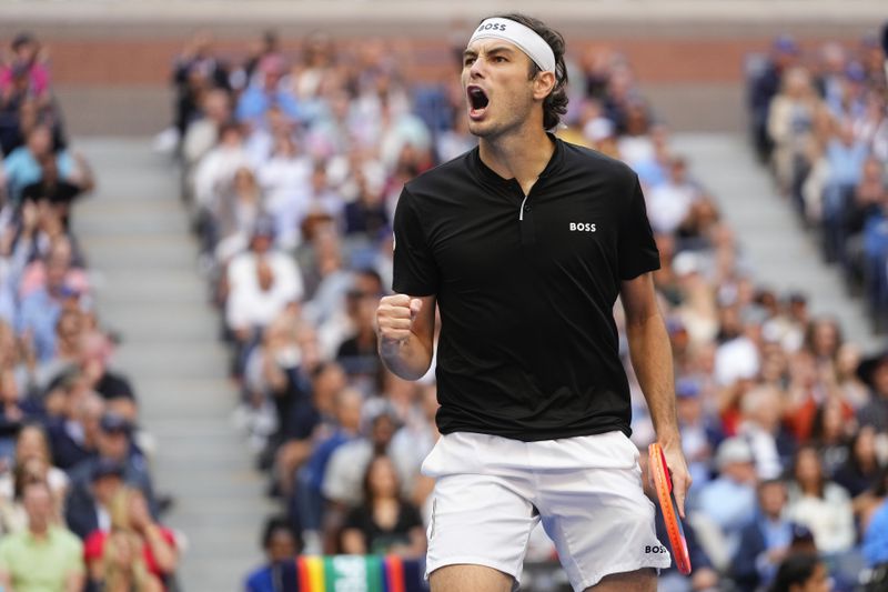 Taylor Fritz, of the United States, reacts in the third set against Jannik Sinner, of Italy, during the men's singles final of the U.S. Open tennis championships, Sunday, Sept. 8, 2024, in New York. (AP Photo/Kirsty Wigglesworth)