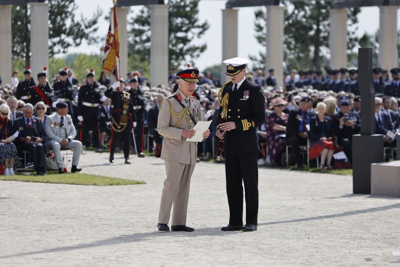 Britain's King Charles III goes to deliver a speech during a commemorative ceremony marking the 80th anniversary of the World War II D-Day" Allied landings in Normandy, at the World War II British Normandy Memorial of Ver-sur-Mer, Thursday, June 6, 2024. Normandy is hosting various events to officially commemorate the 80th anniversary of the D-Day landings that took place on June 6, 1944. (Ludovic Marin/Pool via AP)