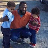 In this 2015 family photo, Antonio May poses with his sons Za'Kobe and Jordan Rickerson. In September 2018, May was pronounced dead after being repeatedly shocked with a Taser in the Fulton County jail. On Nov. 16, 2021, six deputies were indicted on five counts, including felony murder.