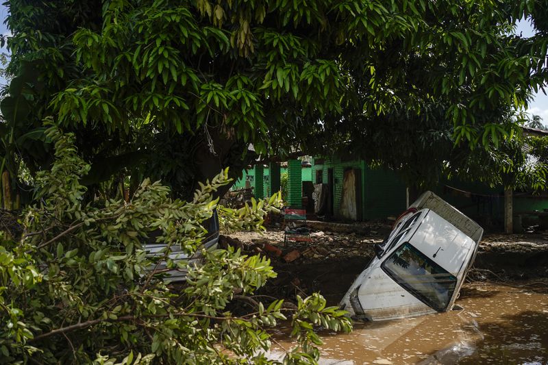 A vehicle lies damaged after Hurricane John passed through Coyuca de Benitez, Guerrero state, Mexico, Monday, Sept. 30, 2024. (AP Photo/Felix Marquez)