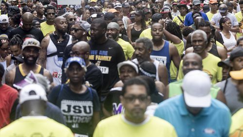 Race participants line up on 10th Street before the start of the 17th Annual Atlanta HBCU Alumni Alliance 5K Run/Walk at Piedmont Park on Saturday morning, June 29, 2024. (Photo Courtesy of Steve Schaefer/Atlanta Journal-Constitution)