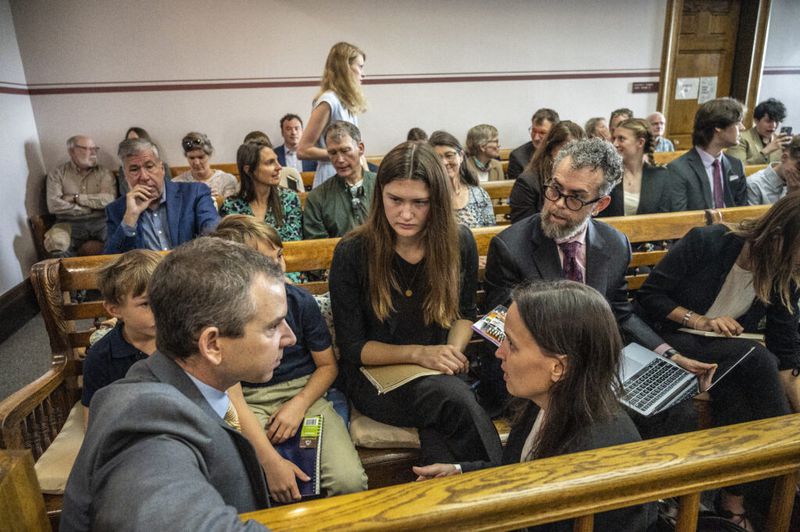 FILE: Youth plaintiffs conferring with members of Our Children’s Trust legal team before the start of the nation’s first youth climate change trial, Held v. Montana in Helena, Montana, in 2023. (Photo by William Campbell/Getty Images)