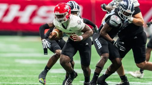 Savannah Christian’s Zo Smalls (4) breaks through the defensive line during the Class 3A GHSA State Championship game at Mercedes-Benz Stadium, on Wednesday, Dec. 13, 2023, in Atlanta. (Jason Allen for the Atlanta Journal Constitution)