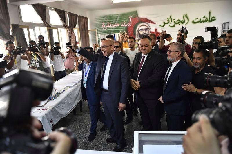 Presidential candidate of the Movement of Society for Peace (MSP), Abdelali Hassani Cherif, prepares to cast his ballot inside a polling station during the presidential election, Saturday, Sept. 7, 2024, in Algiers, Algeria. (AP Photo/Fateh Guidoum)